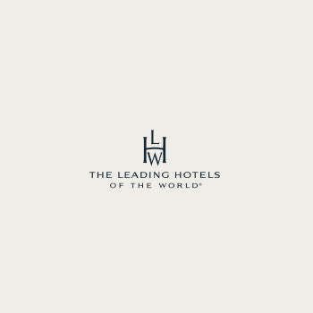 Logotipo de The Leading Hotels of the World, con el monograma estilizado de la marca.
