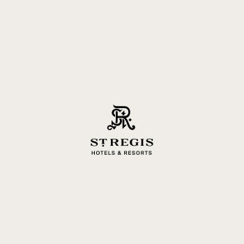 Logotipo de St. Regis, con el texto y un monograma o símbolo estilizado arriba.