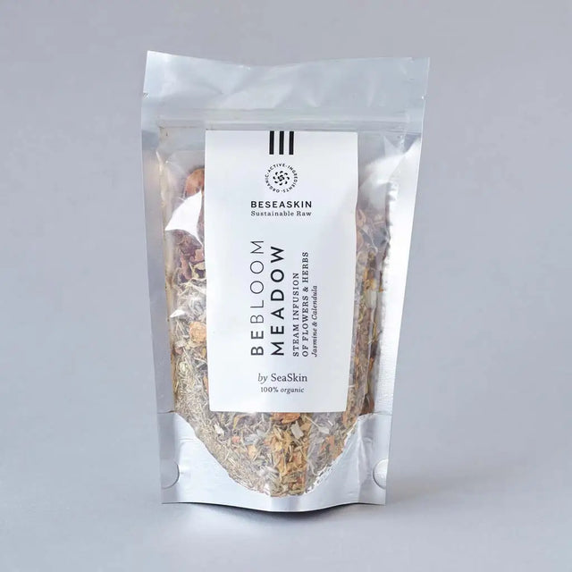 Envase de infusión floral de Beseaskin, 100% orgánica a base de Jazmín y Caléndula con fondo gris.