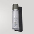 Envase de loción limpiadora purificante de Seaskin, 100% orgánico con Caléndula, Orquídea y Propóleos sobre mesa blanca.